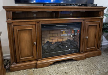Channley - XL TV Stand With Fireplace Option - Brown